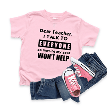Load image into Gallery viewer, KIDS funny &quot;Dear Teacher I talk to everyone so movin&#39; my seat...&quot; t-shirt in Black &amp; Pink. School is finally back in person!!!! At least it is here in northern Illinois. And because they haven&#39;t seen many of their friends for so long, I think you need to tell the teacher what to expect!!! (hahaha) It&#39;s gonna be a long year if they try to keep the kids totally quiet. So here&#39;s some advise from all of us.....especially your kid!!!!  :)  50% cotton / 50% polyester