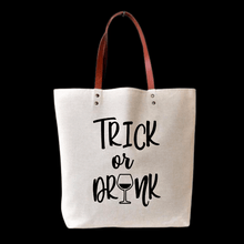 Load image into Gallery viewer, MOM needs her own HALLOWEEN TRICK or DRINK tote bag while takin&#39; the kiddos out for Trick or Treat!!! One bag that you&#39;ll be carrying around all the time!! Your everyday bag that u can use for everything....grocery shopping, farmers market, library bag, book bag &amp; yes, your bag for holding your liquor!!! LOL  My favorite is to use these as a gift bag... giving a gift inside a gift. Like liquor!!! :)  Cotton tote bag with light brown faux leather handle. 15&quot; (w) x 16.5&quot; (h).  All totes are washable!